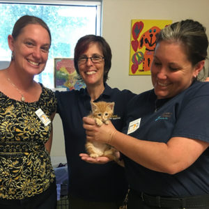 Dr. Hurley with shelter workers