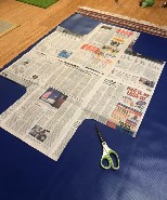 newspaper template laid over vinyl fabric